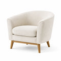 Sillón beige de tela bouclé con base de madera